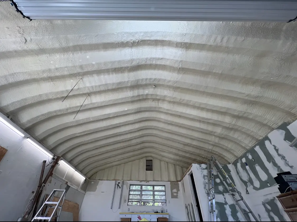 Spray polyurethane foam applied to the underside of a metal roof deck in Laguna Woods